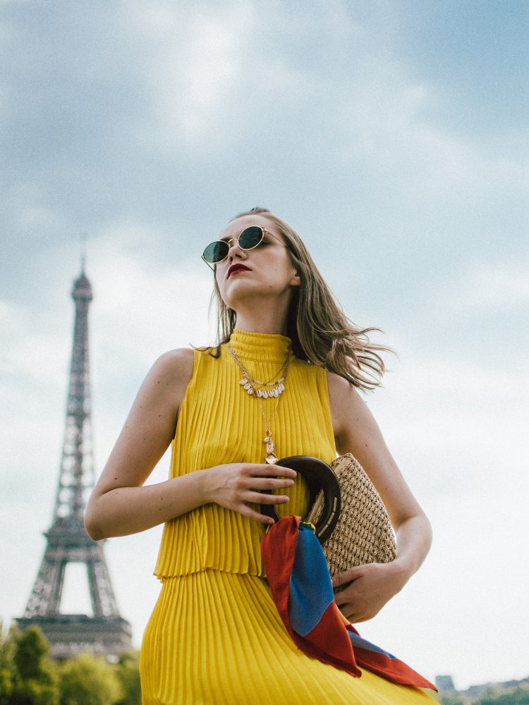 Massimo Dutti pleated yellow dress, gucci ace heart sneakers, paris, andreea birsan, couturezilla, cute summer outfit ideas for 2018, midi yellow dress, what to wear as a wedding guest, summer wedding guest dress, versatile wedding guest dresses, pleated dress, how to wear a midi dress, how to wear pleated dresses, dressed in dutti, massimo dutti dresses, yellow massimo dutti dress, dress and sneakers, gucci ace heart embroidered white leather sneakers, gucci trainers, the best gucci sneakers, shoes to invest in, should worth investing in, the best gucci sneakers, gucci kicks, white leather sneakers, durable sneakers, micro oval sunglasses, ray ban inspired sunglasses, straw bag, the best summer bags, mini bags, wood handle bag, striped scarf, tourist in paris, paris for a day, silk scarf, shell necklaces, gold layered necklaces, yellow dress to wear this summer, how to wear a dress with sneakers, sporty and chic outfit, half bun, wood handle handmade bag, the best summer bags, boho peach bag, eiffel tower photos, blogger photos from paris, the best views in paris, how to get a photo with the eiffel tower in the background, best photo spots in paris, instagram worthy spots in paris, france, travel blogger, european summer, summer vacation in paris, best instagram spots in paris, how to look Parisian chic, European summer street style inspiration for women 2017, pinterest chic outfit ideas for woman, summer outfit ideas, summer ootd inspiration, outfit of the day, ootd, fashion icon, style inspiration, fashionista, fashion inspiration, style inspo, what to wear in summer, how to look French, chic on a budget, zara outfit, mango, topshop, asos, river island, forever 21, urban outfitters, how to mix high end pieces with luxury ones, zara and Gucci,outfit alternatives for summer, tomboy chic, minimal outfit, tumblr girls photos, pictures, happy girl, women, smart casual outfits, the best outfit ideas 2017, what to wear when you don’t feel inspired, summer in Europe, weekend attire, uniform, French women in summer, European outfit ideas 2017, minimal chic outfit, how to stand out, the best outfit ideas for summer, the sunglasses you have seen everywhere on Instagram, glasses, uk fashion blogger, united kingdom, uk fashion blog, fashion and travel blog, Europe, women with style, street style, summer fashion trends 2017, best fashion ideas, styling, fall fashion, fall outfit, fall ootd, fall perfect, transitional dressing, best transitional outfit ideas, how to wear statement earrings, dressing for autumn, autumn outfit, winter outfit ideas for work and school 2017