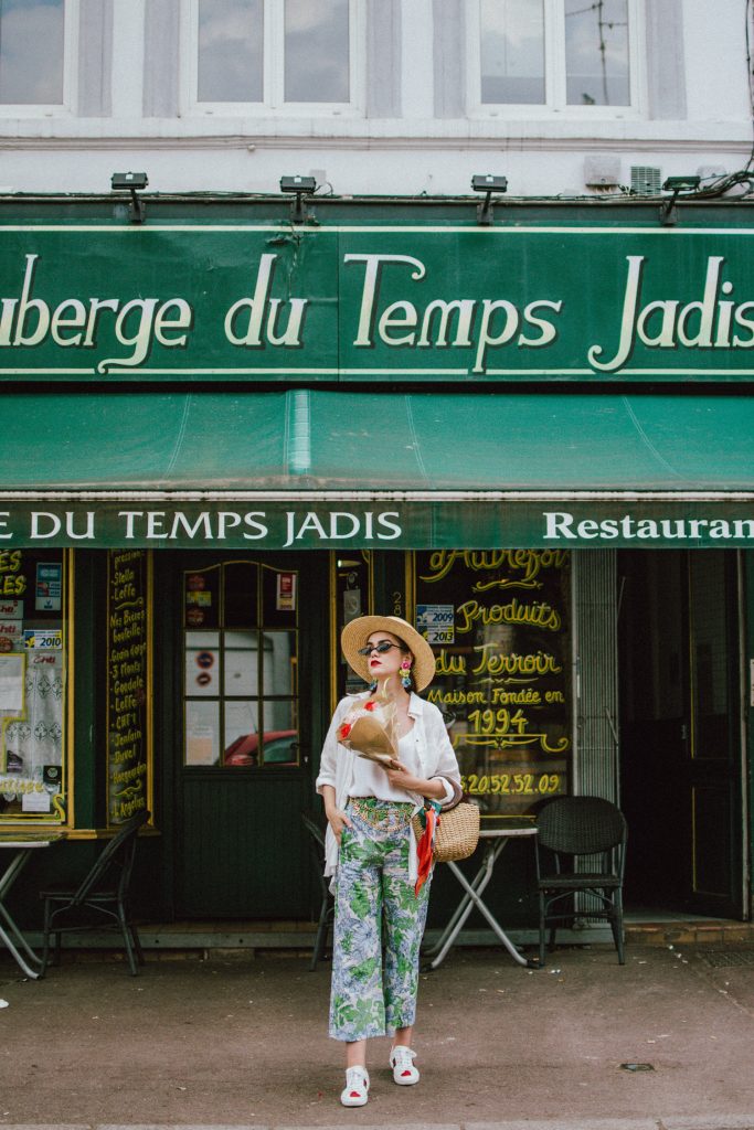 Zara floral print pants, flower print culottes, why you should wear floral print trousers, floral culottes, green blue and white pants, white cami top, mango camisole top, zara button down white linen shirt, boyfriend shirt, oversized shirt, gucci ace heart embroidered sneakers, gucci white sneakers, white leather sneakers, gucci trainers, h&m straw boater hat, summer straw bag with wooden handle, mini bag, the best summer bags, micro cat eye sunglasses, andreea birsan, couturezilla, cute summer outfit ideas 2018, sunnies, retro sunglasses, the asos sold out micro sunglasses, statement floral earrings, zara flower earrings, striped silk scarf, parisian cafe, andreea birsan travels to france, lille france, travel diary, what to wear when you travel to europe in summer, the perfect european summer outfit, how to wear a white shirt in different ways, handmade bags, bag made in thailand, wicker bag, natural fabric bag, how to wear florals, what to wear with floral printed pants, how to pull off culottes, what shoes to wear with culottes, tourist outfit, how to look Parisian chic, European summer street style inspiration for women 2017, pinterest chic outfit ideas for woman, summer outfit ideas, summer ootd inspiration, outfit of the day, ootd, fashion icon, style inspiration, fashionista, fashion inspiration, style inspo, what to wear in summer, how to look French, chic on a budget, zara outfit, mango, topshop, asos, river island, forever 21, urban outfitters, how to mix high end pieces with luxury ones, zara and Gucci,outfit alternatives for summer, tomboy chic, minimal outfit, tumblr girls photos, pictures, happy girl, women, smart casual outfits, the best outfit ideas 2017, what to wear when you don’t feel inspired, summer in Europe, weekend attire, uniform, French women in summer, European outfit ideas 2017, minimal chic outfit, how to stand out, the best outfit ideas for summer, the sunglasses you have seen everywhere on Instagram, glasses, uk fashion blogger, united kingdom, uk fashion blog, fashion and travel blog, Europe, women with style, street style, summer fashion trends 2017, best fashion ideas, styling, fall fashion, fall outfit, fall ootd, fall perfect, transitional dressing, best transitional outfit ideas, how to wear statement earrings, dressing for autumn, autumn outfit, winter outfit ideas for work and school 2017