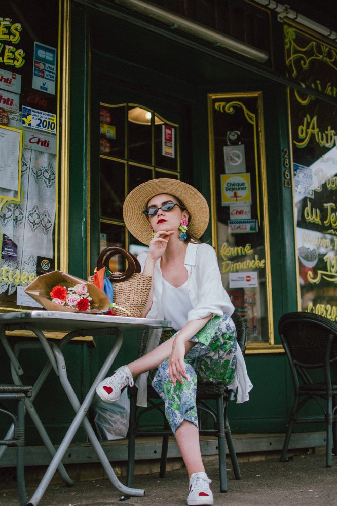 Zara floral print pants, flower print culottes, why you should wear floral print trousers, floral culottes, green blue and white pants, white cami top, mango camisole top, zara button down white linen shirt, boyfriend shirt, oversized shirt, gucci ace heart embroidered sneakers, gucci white sneakers, white leather sneakers, gucci trainers, h&m straw boater hat, summer straw bag with wooden handle, mini bag, the best summer bags, micro cat eye sunglasses, andreea birsan, couturezilla, cute summer outfit ideas 2018, sunnies, retro sunglasses, the asos sold out micro sunglasses, statement floral earrings, zara flower earrings, striped silk scarf, parisian cafe, andreea birsan travels to france, lille france, travel diary, what to wear when you travel to europe in summer, the perfect european summer outfit, how to wear a white shirt in different ways, handmade bags, bag made in thailand, wicker bag, natural fabric bag, how to wear florals, what to wear with floral printed pants, how to pull off culottes, what shoes to wear with culottes, tourist outfit, how to look Parisian chic, European summer street style inspiration for women 2017, pinterest chic outfit ideas for woman, summer outfit ideas, summer ootd inspiration, outfit of the day, ootd, fashion icon, style inspiration, fashionista, fashion inspiration, style inspo, what to wear in summer, how to look French, chic on a budget, zara outfit, mango, topshop, asos, river island, forever 21, urban outfitters, how to mix high end pieces with luxury ones, zara and Gucci,outfit alternatives for summer, tomboy chic, minimal outfit, tumblr girls photos, pictures, happy girl, women, smart casual outfits, the best outfit ideas 2017, what to wear when you don’t feel inspired, summer in Europe, weekend attire, uniform, French women in summer, European outfit ideas 2017, minimal chic outfit, how to stand out, the best outfit ideas for summer, the sunglasses you have seen everywhere on Instagram, glasses, uk fashion blogger, united kingdom, uk fashion blog, fashion and travel blog, Europe, women with style, street style, summer fashion trends 2017, best fashion ideas, styling, fall fashion, fall outfit, fall ootd, fall perfect, transitional dressing, best transitional outfit ideas, how to wear statement earrings, dressing for autumn, autumn outfit, winter outfit ideas for work and school 2017