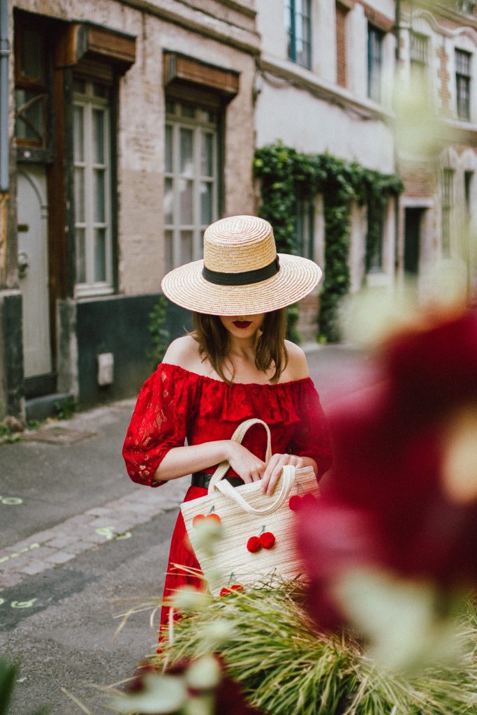 Zara red midi lace dress, ots dress, straw boater hat, red sequin T tommy hilfiger espadrilles, cherry straw bag, france, andreea birsan, couturezilla, cute summer outfit ideas 2018, off the shoulder lace, travel to lille, tourist outfit, summer in europe, red midi dress, clear lens aviator glasses, what to wear in summer, european summer, how to wear a lace dress in a casual way, boater hat, raffia bag with cherry pom poms, statement summer tote bag, espadrilles, geeky clear lens glasses trend, how to wear a lace dress during the day, how to wear a midi dress, how to look Parisian chic, European summer street style inspiration for women 2017, pinterest chic outfit ideas for woman, summer outfit ideas, summer ootd inspiration, outfit of the day, ootd, fashion icon, style inspiration, fashionista, fashion inspiration, style inspo, what to wear in summer, how to look French, chic on a budget, zara outfit, mango, topshop, asos, river island, forever 21, urban outfitters, how to mix high end pieces with luxury ones, zara and Gucci,outfit alternatives for summer, tomboy chic, minimal outfit, tumblr girls photos, pictures, happy girl, women, smart casual outfits, the best outfit ideas 2017, what to wear when you don’t feel inspired, summer in Europe, weekend attire, uniform, French women in summer, European outfit ideas 2017, minimal chic outfit, how to stand out, the best outfit ideas for summer, the sunglasses you have seen everywhere on Instagram, glasses, uk fashion blogger, united kingdom, uk fashion blog, fashion and travel blog, Europe, women with style, street style, summer fashion trends 2017, best fashion ideas, styling, fall fashion, fall outfit, fall ootd, fall perfect, transitional dressing, best transitional outfit ideas, how to wear statement earrings, dressing for autumn, autumn outfit, winter outfit ideas for work and school 2017