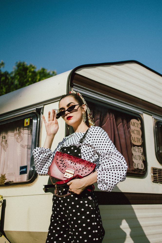 Polka dot denim dungaree, balloon sleeve top, white heels, red furla bag, andreea birsan, couturezilla, cute fall outfit ideas 2018fashion, fall outfit, fall ootd, fall perfect, transitional dressing, best transitional outfit ideas, how to wear statement earrings, dressing for autumn, autumn outfit, winter outfit ideas for work and school 2017, black and white polka dot denim dungarees, denim overall, how to look chic in denim dungarees, polka dot jumpsuit, polka dot overall for fall 2018, how to layer a jumpsuit, what to wear with a denim overall, how to avoic looking like a kid in dungarees, how to pattern clash, how to mix two polka dot pieces, what to wear with polka dots, how to make polka dots look chic, black white and red outfit, what shoes to wear with wide leg dungarees, wide leg polka dot denim dungarees, culotte dungarees, zara cotton white polka dot lantern sleeve blouse, polka dot balloon sleeve top, polka dot shirt, chic polka dot top, statement earrings, rhinestone earrings, teardrop rhinestone earrings, asos small cat eye sunglasses, micro sunglasses trend, mini sunglasses, small sunglasses, small cat eye sunnies, burgundy scarf, how to style a silk scarf in your hair, hair scarf, pony tail with scarf, white leather pumps, white block heel leather pumps, white square heel pumps, ruby red lace insertion furla metropolis shoulder bag, red furla metropolis, insertion furla metropolis bag, chain belt, la femme chain belt, sold out chain belt, how to style denim dungarees in fall, autumn outfit ideas 2018, how to look Parisian chic, European summer street style inspiration for women 2017, pinterest chic outfit ideas for woman, summer outfit ideas, summer ootd inspiration, outfit of the day, ootd, fashion icon, style inspiration, fashionista, fashion inspiration, style inspo, what to wear in summer, how to look French, chic on a budget, zara outfit, mango, topshop, asos, river island, forever 21, urban outfitters, how to mix high end pieces with luxury ones, zara and Gucci,outfit alternatives for summer, tomboy chic, minimal outfit, tumblr girls photos, pictures, happy girl, women, smart casual outfits, the best outfit ideas 2017, what to wear when you don’t feel inspired, summer in Europe, weekend attire, uniform, French women in summer, European outfit ideas 2017, minimal chic outfit, how to stand out, the best outfit ideas for summer, the sunglasses you have seen everywhere on Instagram, glasses, uk fashion blogger, united kingdom, uk fashion blog, fashion and travel blog, Europe, women with style, street style, summer fashion trends 2017, best fashion ideas, styling, fall fashion, fall outfit, fall ootd, fall perfect, transitional dressing, best transitional outfit ideas, how to wear statement earrings, dressing for autumn, autumn outfit, winter outfit ideas for work and school 2017