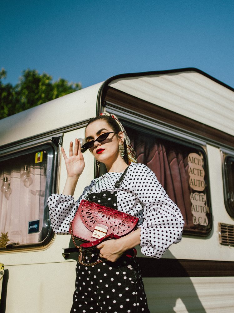 Polka dot denim dungaree, balloon sleeve top, white heels, red furla bag, andreea birsan, couturezilla, cute fall outfit ideas 2018fashion, fall outfit, fall ootd, fall perfect, transitional dressing, best transitional outfit ideas, how to wear statement earrings, dressing for autumn, autumn outfit, winter outfit ideas for work and school 2017, black and white polka dot denim dungarees, denim overall, how to look chic in denim dungarees, polka dot jumpsuit, polka dot overall for fall 2018, how to layer a jumpsuit, what to wear with a denim overall, how to avoic looking like a kid in dungarees, how to pattern clash, how to mix two polka dot pieces, what to wear with polka dots, how to make polka dots look chic, black white and red outfit, what shoes to wear with wide leg dungarees, wide leg polka dot denim dungarees, culotte dungarees, zara cotton white polka dot lantern sleeve blouse, polka dot balloon sleeve top, polka dot shirt, chic polka dot top, statement earrings, rhinestone earrings, teardrop rhinestone earrings, asos small cat eye sunglasses, micro sunglasses trend, mini sunglasses, small sunglasses, small cat eye sunnies, burgundy scarf, how to style a silk scarf in your hair, hair scarf, pony tail with scarf, white leather pumps, white block heel leather pumps, white square heel pumps, ruby red lace insertion furla metropolis shoulder bag, red furla metropolis, insertion furla metropolis bag, chain belt, la femme chain belt, sold out chain belt, how to style denim dungarees in fall, autumn outfit ideas 2018, how to look Parisian chic, European summer street style inspiration for women 2017, pinterest chic outfit ideas for woman, summer outfit ideas, summer ootd inspiration, outfit of the day, ootd, fashion icon, style inspiration, fashionista, fashion inspiration, style inspo, what to wear in summer, how to look French, chic on a budget, zara outfit, mango, topshop, asos, river island, forever 21, urban outfitters, how to mix high end pieces with luxury ones, zara and Gucci,outfit alternatives for summer, tomboy chic, minimal outfit, tumblr girls photos, pictures, happy girl, women, smart casual outfits, the best outfit ideas 2017, what to wear when you don’t feel inspired, summer in Europe, weekend attire, uniform, French women in summer, European outfit ideas 2017, minimal chic outfit, how to stand out, the best outfit ideas for summer, the sunglasses you have seen everywhere on Instagram, glasses, uk fashion blogger, united kingdom, uk fashion blog, fashion and travel blog, Europe, women with style, street style, summer fashion trends 2017, best fashion ideas, styling, fall fashion, fall outfit, fall ootd, fall perfect, transitional dressing, best transitional outfit ideas, how to wear statement earrings, dressing for autumn, autumn outfit, winter outfit ideas for work and school 2017