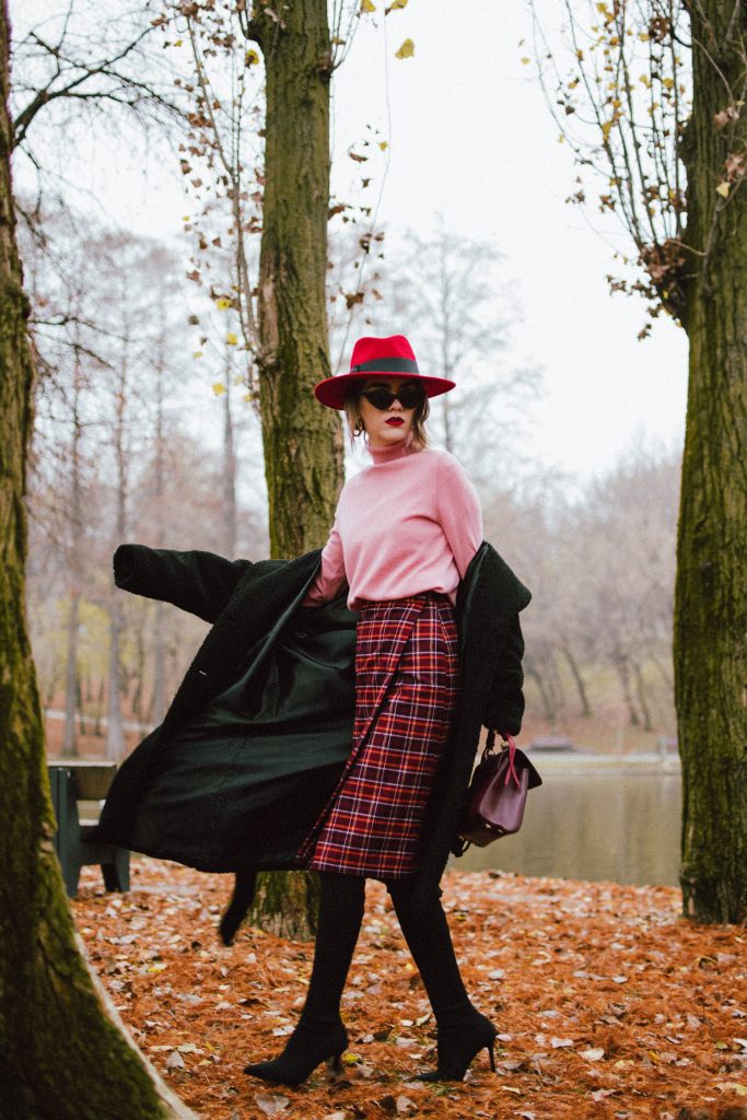 Black teddy bear coat, midi tartan skirt, pink wool turtleneck sweater, red fedora hat, otk sock boots, andreea birsan street style, couturezilla, cute fall and winter outfit ideas 2018, how to wear a midi skirt with over the knee boots in winter and autumn, how to pull off midi skirts and otk boots, over the knee black heeled sock boots, massimo dutti dusty pink wool turtleneck sweater, what to wear with a pink sweater, what other color goes with pink, midi tartan skirt, wrap tartan skirt, how to pull off a tartan skirt like a pro, how to wear tartan in winter and fall, long black teddy bear coat, where to find the best teddy bear coat, affordable teddy bear coats, how to pull off teddy bear coats and not look like a child, red wool fedora hat, hats for women, black moschino inspired cat eye sunglasses, otk booties, otk boots trend for fall and winter, burgundy lady bag, burgundy leather bag, italian leather isla fontaine dark red lady bag, where to find statement bags, winter fashion, chic winter outfit ideas, winter layers, how to look Parisian chic, European summer street style inspiration for women 2017, pinterest chic outfit ideas for woman, summer outfit ideas, summer ootd inspiration, outfit of the day, ootd, fashion icon, style inspiration, fashionista, fashion inspiration, style inspo, what to wear in summer, how to look French, chic on a budget, zara outfit, mango, topshop, asos, river island, forever 21, urban outfitters, how to mix high end pieces with luxury ones, zara and Gucci,outfit alternatives for summer, tomboy chic, minimal outfit, tumblr girls photos, pictures, happy girl, women, smart casual outfits, the best outfit ideas 2017, what to wear when you don’t feel inspired, summer in Europe, weekend attire, uniform, French women in summer, European outfit ideas 2017, minimal chic outfit, how to stand out, the best outfit ideas for summer, the sunglasses you have seen everywhere on Instagram, glasses, uk fashion blogger, united kingdom, uk fashion blog, fashion and travel blog, Europe, women with style, street style, summer fashion trends 2017, best fashion ideas, styling, fall fashion, fall outfit, fall ootd, fall perfect, transitional dressing, best transitional outfit ideas, how to wear statement earrings, dressing for autumn, autumn outfit, winter outfit ideas for work and school