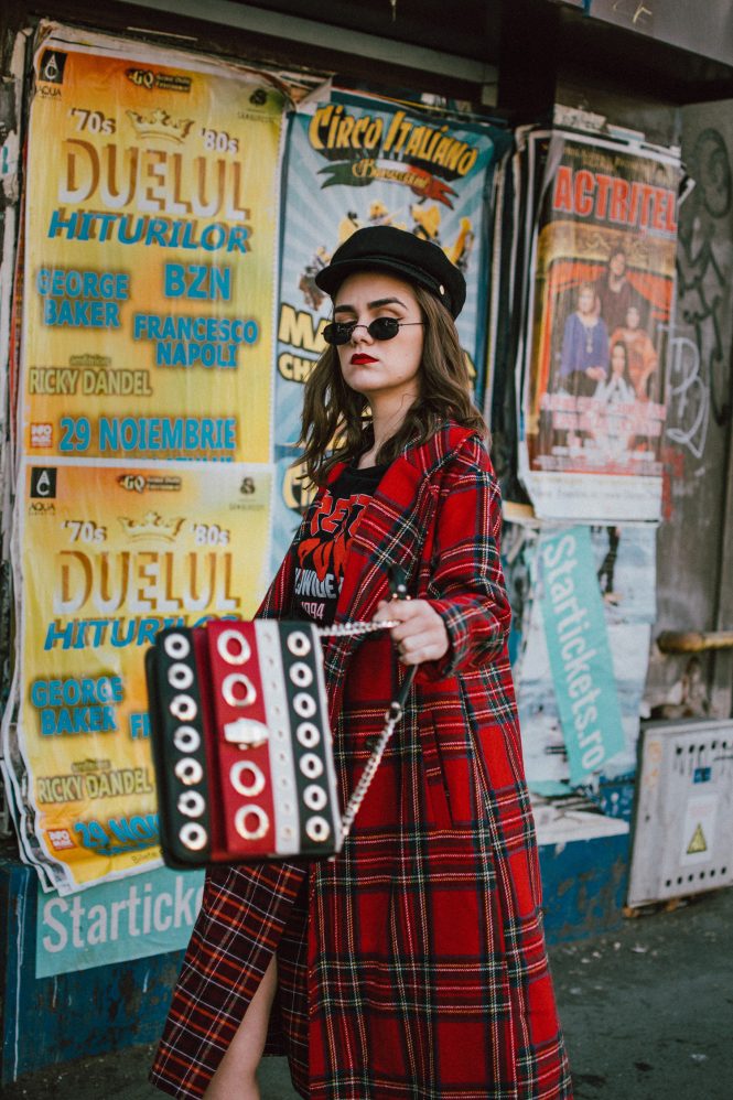 Red tartan coat, midi wrap tartan skirt, black graphic t-shirt, baker boy hat, statement bag, sock boots, andreea birsan street style, couturezilla, cute fall outfit ideas 2018. Boohoo long line red tartan coat, how to wear tartan like a pro, how to wear double tartan, mixing prints in fall 2018, tartan outfit 2018, how to wear red, the baker boy hat trend, newsboy hat, baker boy cap, black military inspired hat, black cap, soft curls, micro oval sunglasses, black vintage sunglasses, small oval sunglasses, punk black graphic t-shirt, red on red outfit, black heeled sock boots, balenciaga inspired sock boots, mango sock boots, where to find the budget alternative of the balenciaga knife sock boots, balenciaga sock boots dupes, cavalli class striped black red and white bag with big eyelets, cavalli class stripe leather shoulder bag, statement shoulder bag, red black and white shoulder bag, multicolor shoulder bag, colorblock leather bag, midi wrap tartan skirt, what shoes go with a midi skirt, midi skirt and heeled sock boots, wrap burgundy tartan midi dress, check print midi dress, scotish print, how to wear tartan in fall and winter 2018, tartan outfit street style 2018, how to look Parisian chic, European summer street style inspiration for women 2017, pinterest chic outfit ideas for woman, summer outfit ideas, summer ootd inspiration, outfit of the day, ootd, fashion icon, style inspiration, fashionista, fashion inspiration, style inspo, what to wear in summer, how to look French, chic on a budget, zara outfit, mango, topshop, asos, river island, forever 21, urban outfitters, how to mix high end pieces with luxury ones, zara and Gucci,outfit alternatives for summer, tomboy chic, minimal outfit, tumblr girls photos, pictures, happy girl, women, smart casual outfits, the best outfit ideas 2017, what to wear when you don’t feel inspired, summer in Europe, weekend attire, uniform, French women in summer, European outfit ideas 2017, minimal chic outfit, how to stand out, the best outfit ideas for summer, the sunglasses you have seen everywhere on Instagram, glasses, uk fashion blogger, united kingdom, uk fashion blog, fashion and travel blog, Europe, women with style, street style, summer fashion trends 2017, best fashion ideas, styling, fall fashion, fall outfit, fall ootd, fall perfect, transitional dressing, best transitional outfit ideas, how to wear statement earrings, dressing for autumn, autumn outfit, winter outfit ideas for work and school